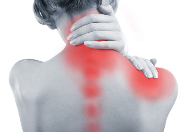 woman with neck, shoulder, and back pain caused by TMJ disorder